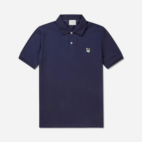 Polo shirt ss with round neck in a regular fit. 100% soft and light quality cotton, adorned with Tonsure teddy badge on the chest
