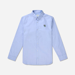 Tonsures statement shirt style is cut from wrinkle-resistant cotton Oxford, embroidered with the iconic Teddy logo at the chest pocket. The shirt has a button-down collar to ensure neat layering under a jacket. Sean Oxford Shirt LS blue - Tonsure